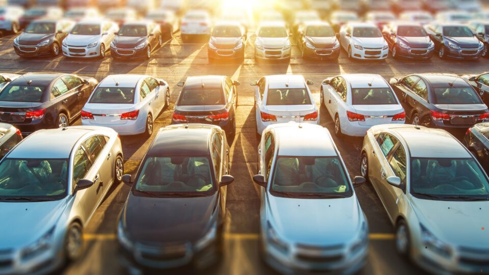 Fleet of sedans in parking lot
